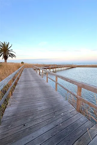 a view of outdoor space and deck with wooden floor