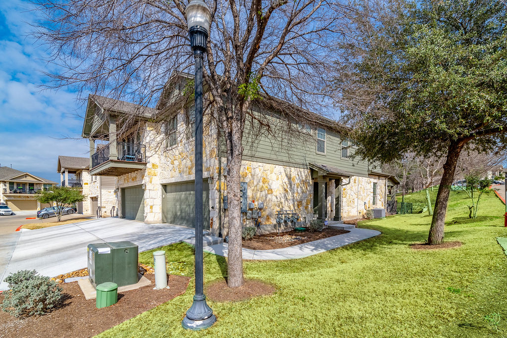 a view of a building with a yard