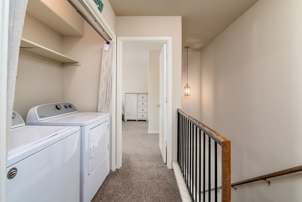 3101 Davis Lane, Unit 8402 Austin, TX 78748 - Photo 14 of 24 a view of a hallway with washer and dryer