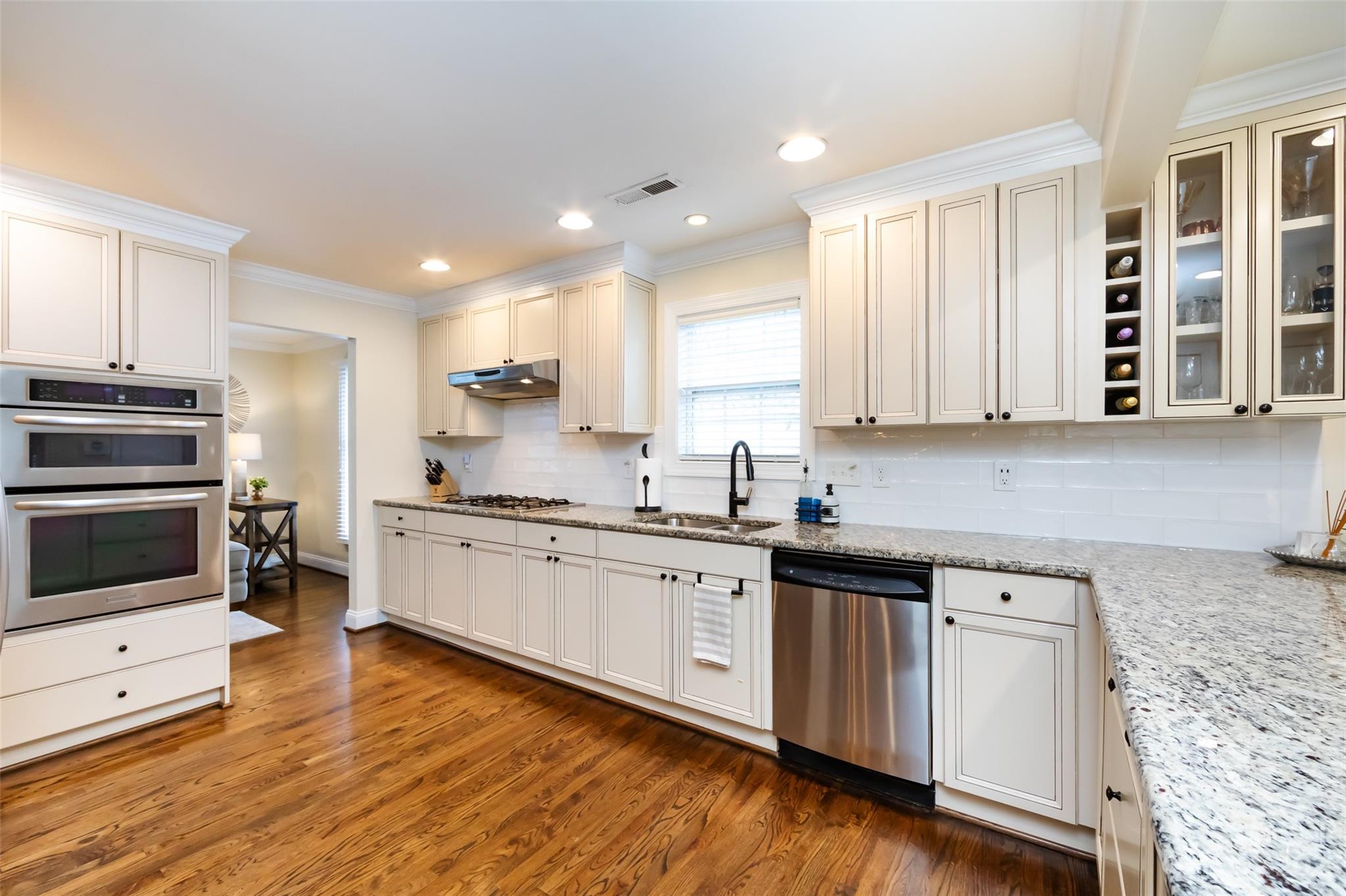 4341 Applegate Road Charlotte, NC 28209 - Photo 12 of 39 a kitchen with stainless steel appliances granite countertop a stove a sink and white cabinets
