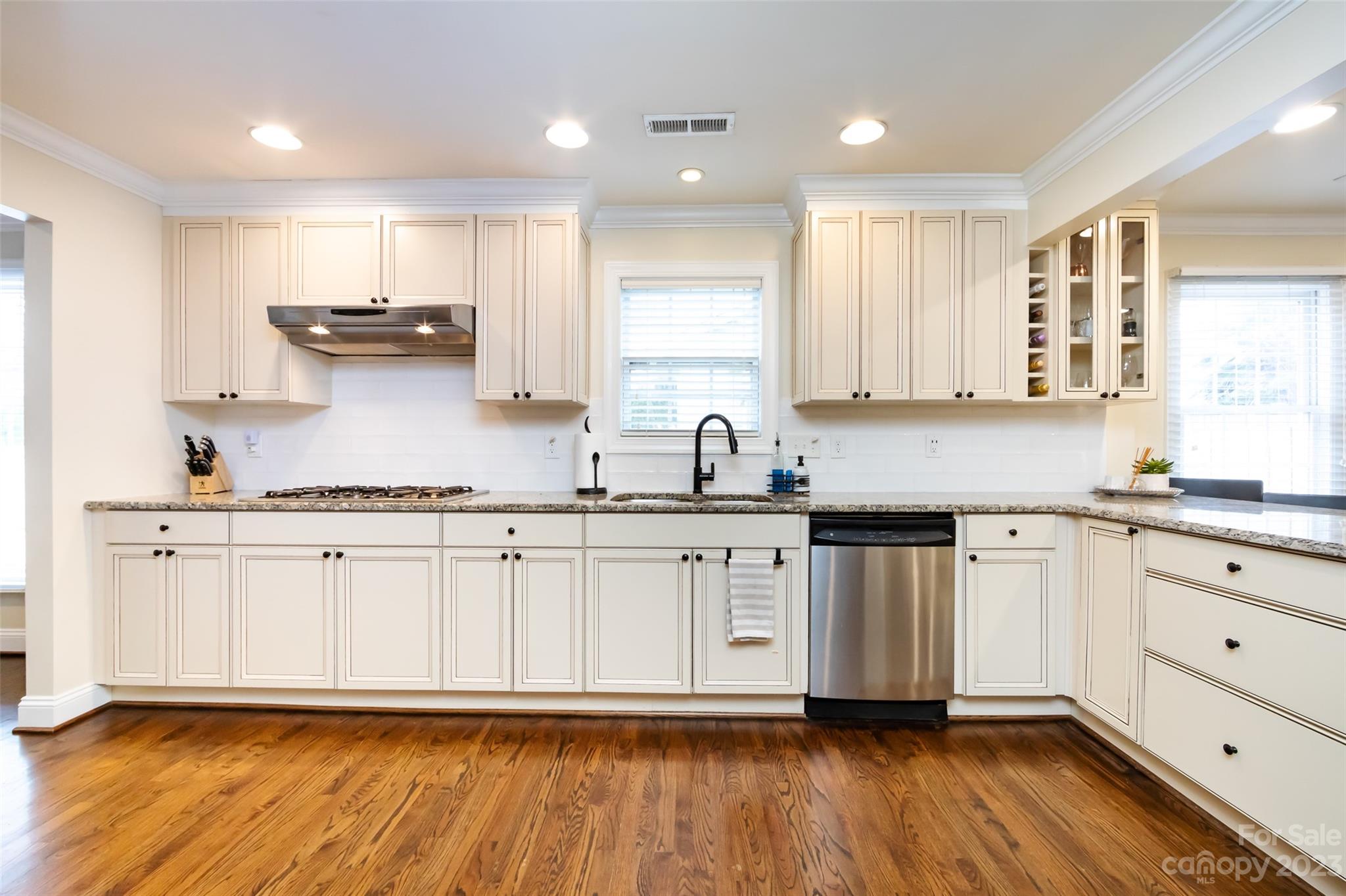 4341 Applegate Road Charlotte, NC 28209 - Photo 13 of 39 a kitchen with stainless steel appliances granite countertop a sink and cabinets