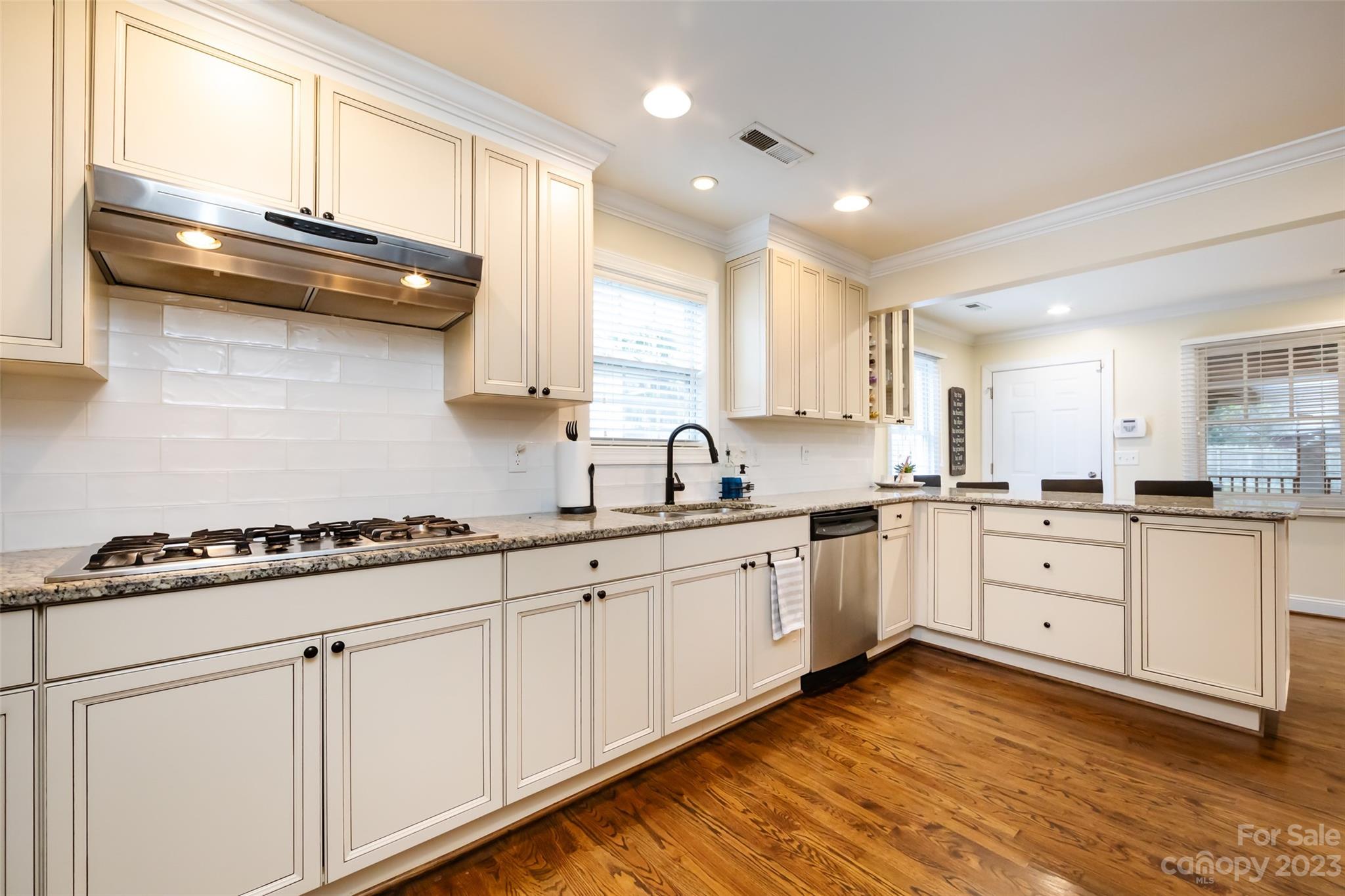 4341 Applegate Road Charlotte, NC 28209 - Photo 16 of 39 a kitchen with granite countertop white cabinets and white appliances