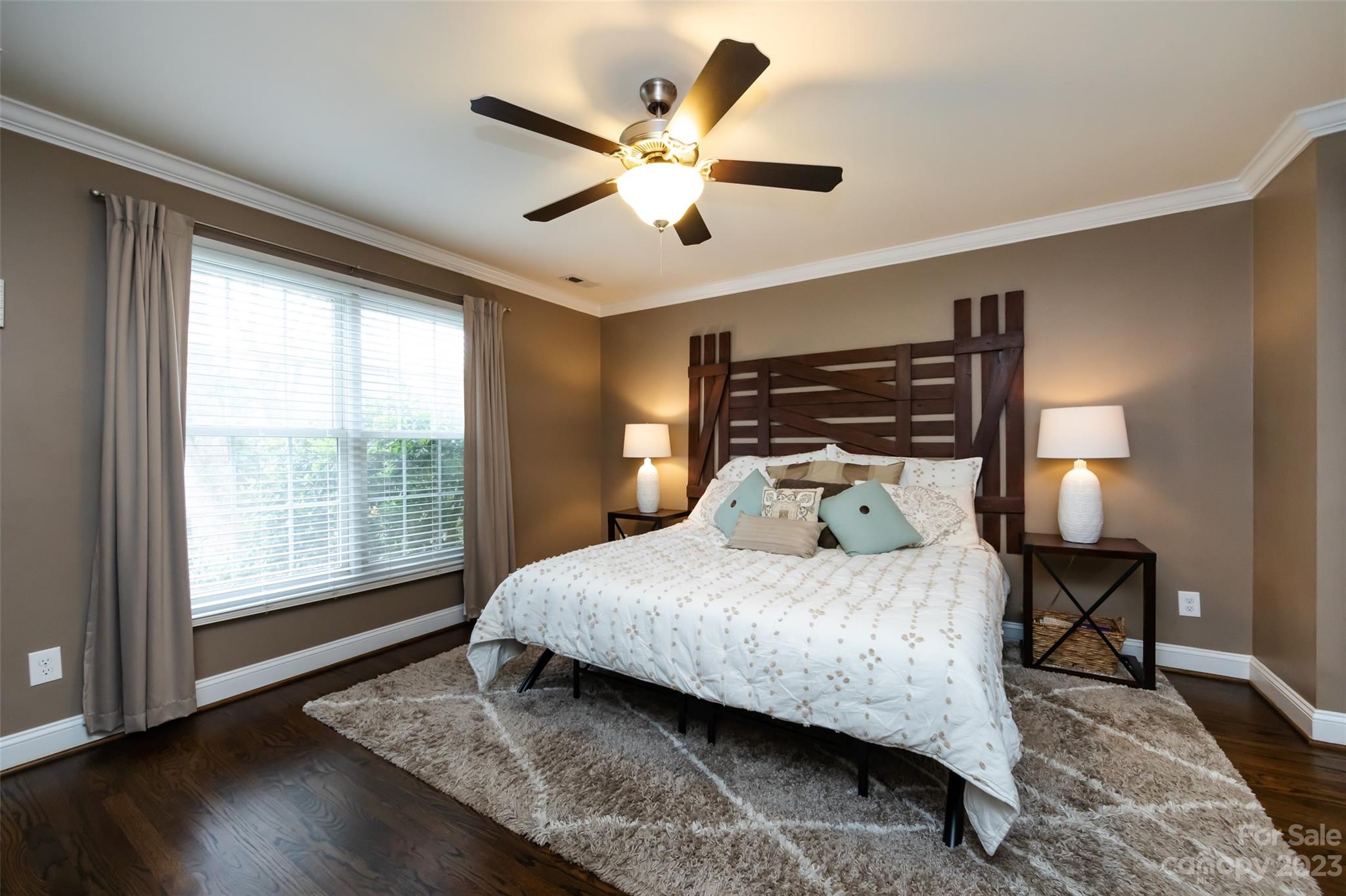 4341 Applegate Road Charlotte, NC 28209 - Photo 22 of 39 a bedroom with a bed and a large window