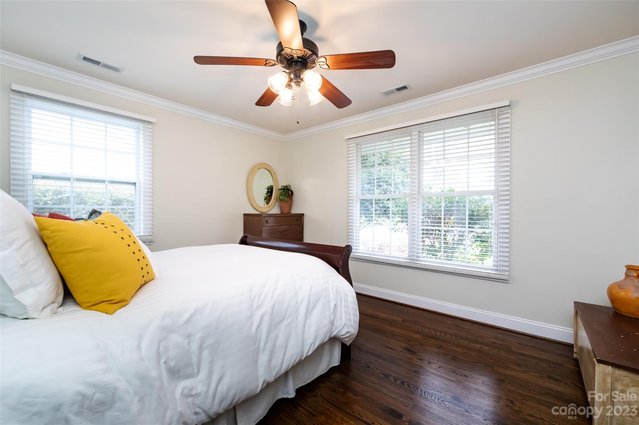 4341 Applegate Road Charlotte, NC 28209 - Photo 28 of 39 a bedroom with a bed and wooden floor
