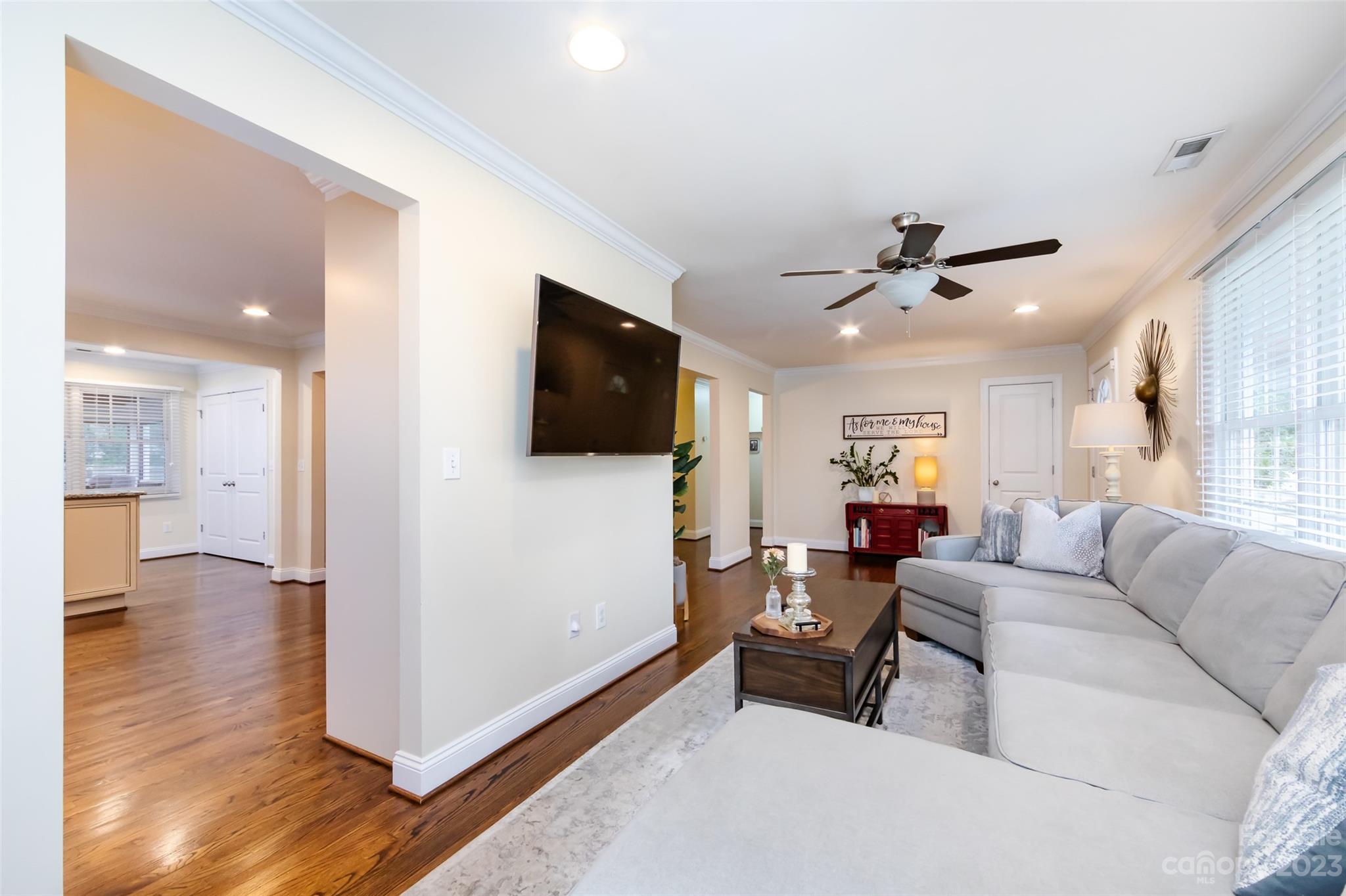 4341 Applegate Road Charlotte, NC 28209 - Photo 8 of 39 a living room with furniture and a flat screen tv