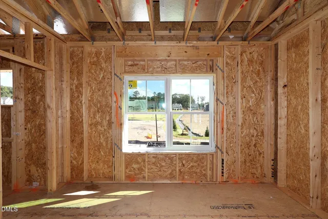 a view of a balcony with wooden walls
