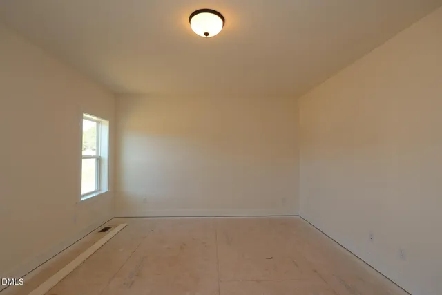 an empty room that has a window