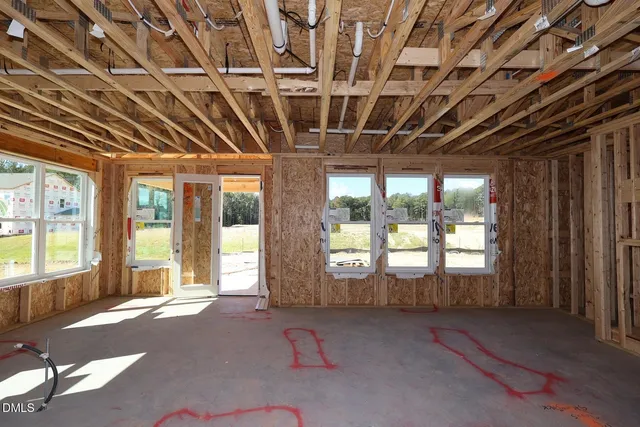 a view of an empty room with windows