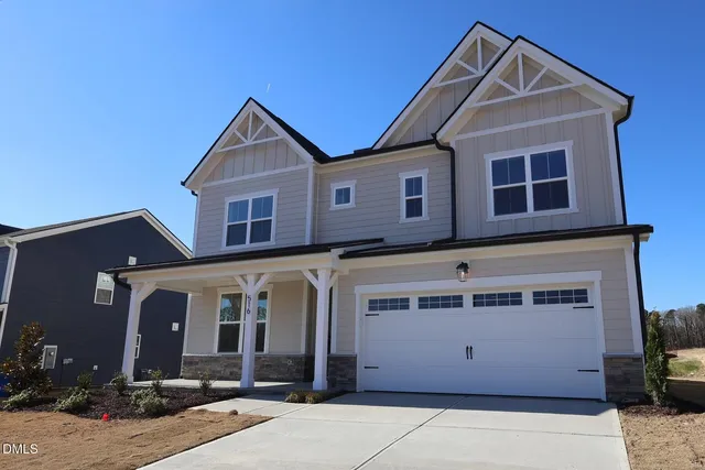 a front view of a house with yard