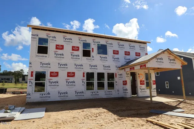 a front view of a building with retail shops