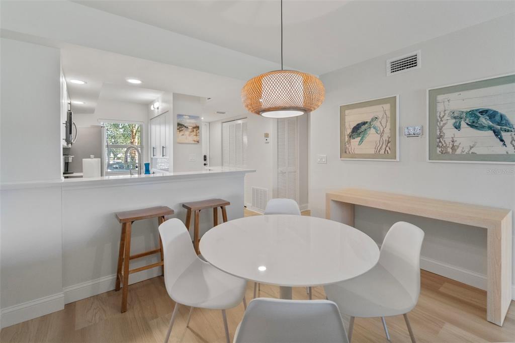433 Cerromar Lane, Unit 441 Venice, FL 34293 - Photo 22 of 65 a view of a dining room with furniture