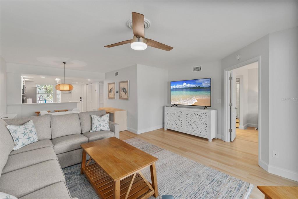 433 Cerromar Lane, Unit 441 Venice, FL 34293 - Photo 29 of 65 a living room with furniture and a rug