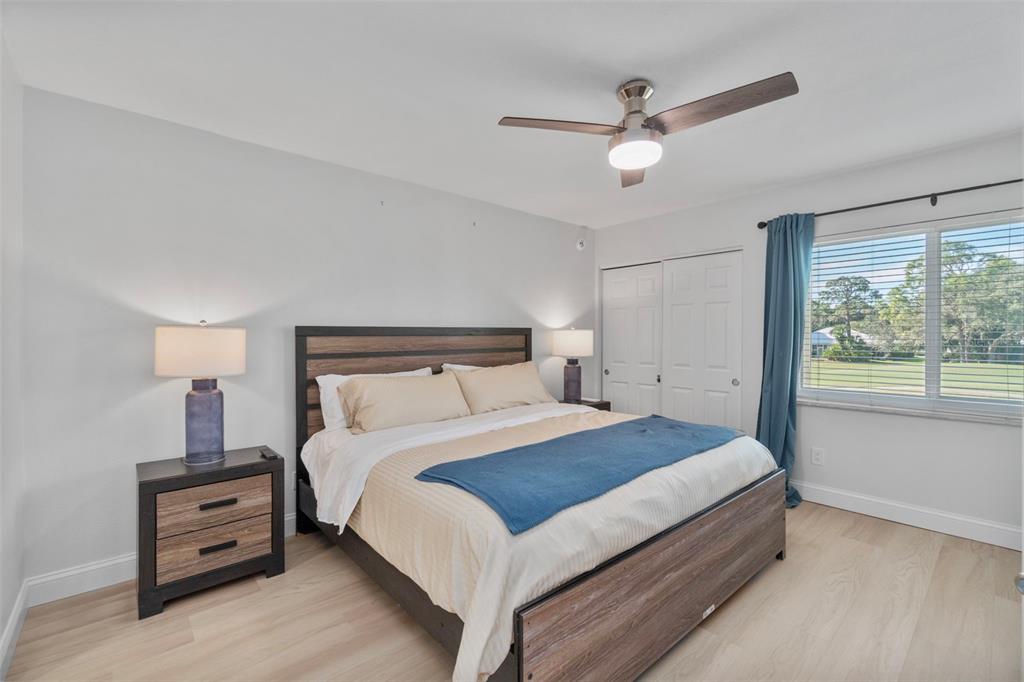 433 Cerromar Lane, Unit 441 Venice, FL 34293 - Photo 36 of 65 a bedroom with a bed and window