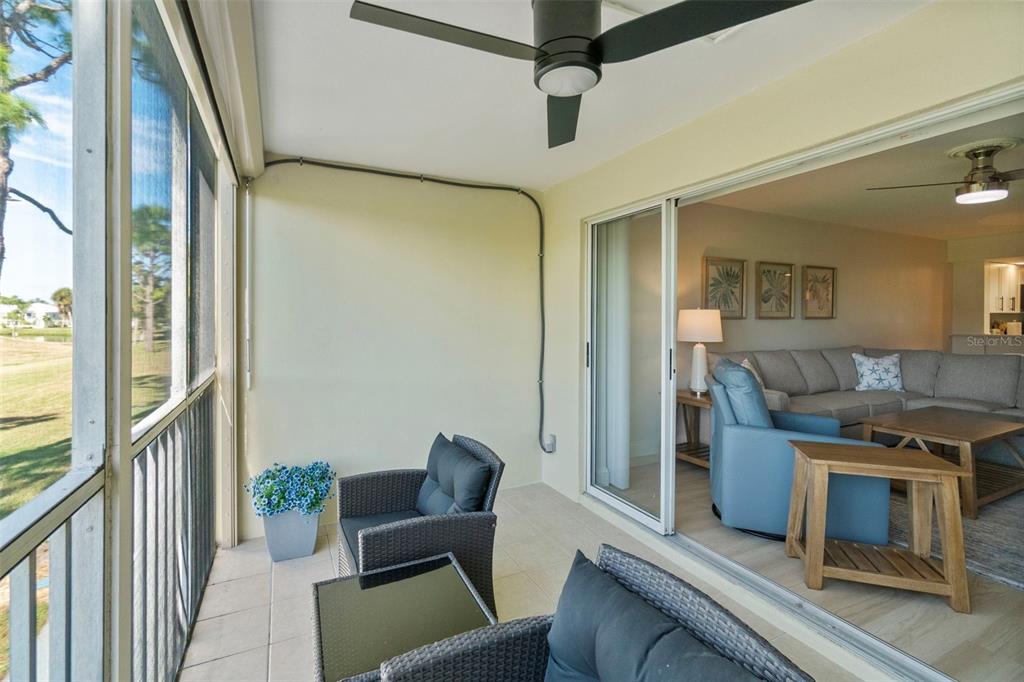 433 Cerromar Lane, Unit 441 Venice, FL 34293 - Photo 53 of 65 a view of a livingroom with furniture and a ceiling fan