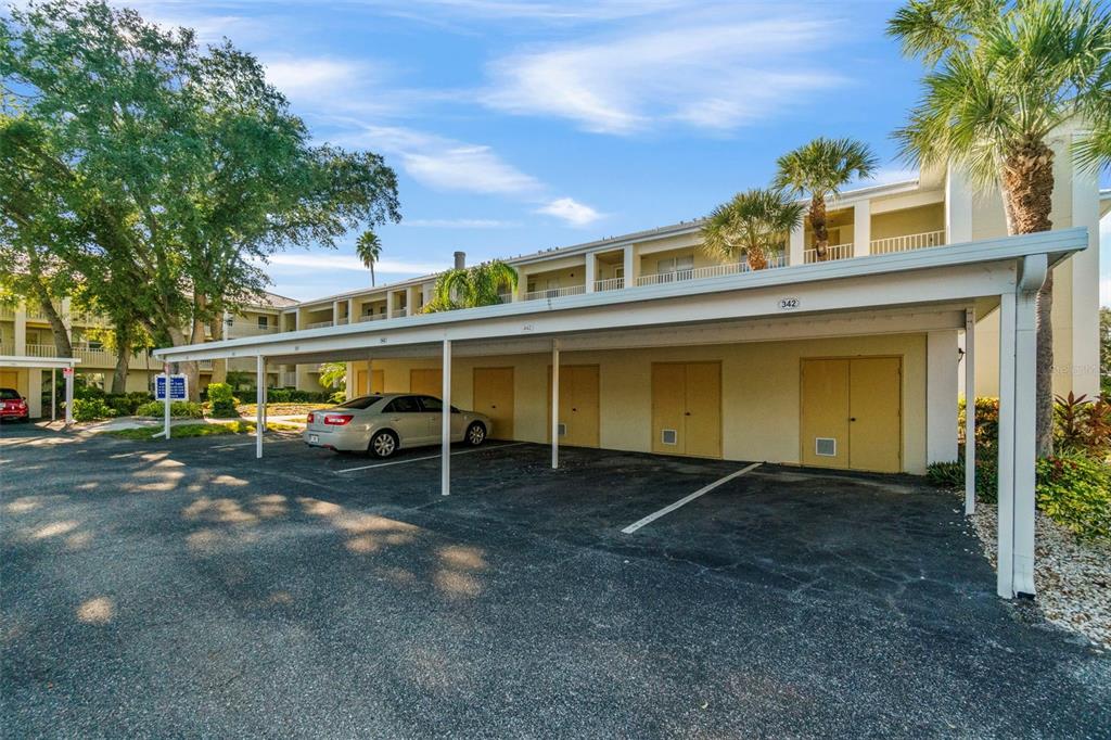 433 Cerromar Lane, Unit 441 Venice, FL 34293 - Photo 62 of 65 a front view of a house with a yard