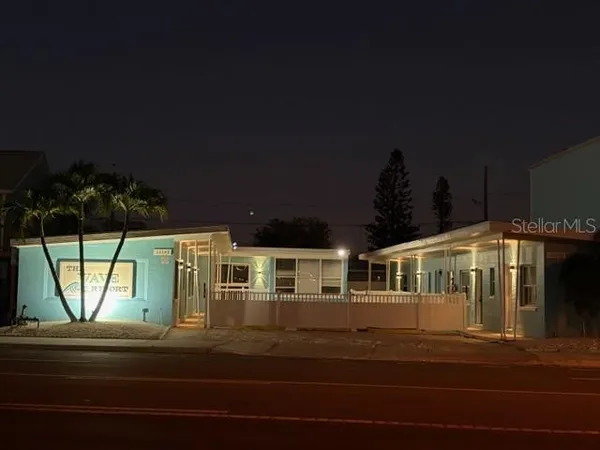 a view of a house with a swimming pool