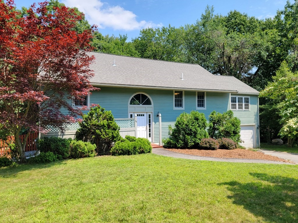 56 Grover Road Ashland, MA 01721 - Photo 1 of 1 a front view of a house with a yard