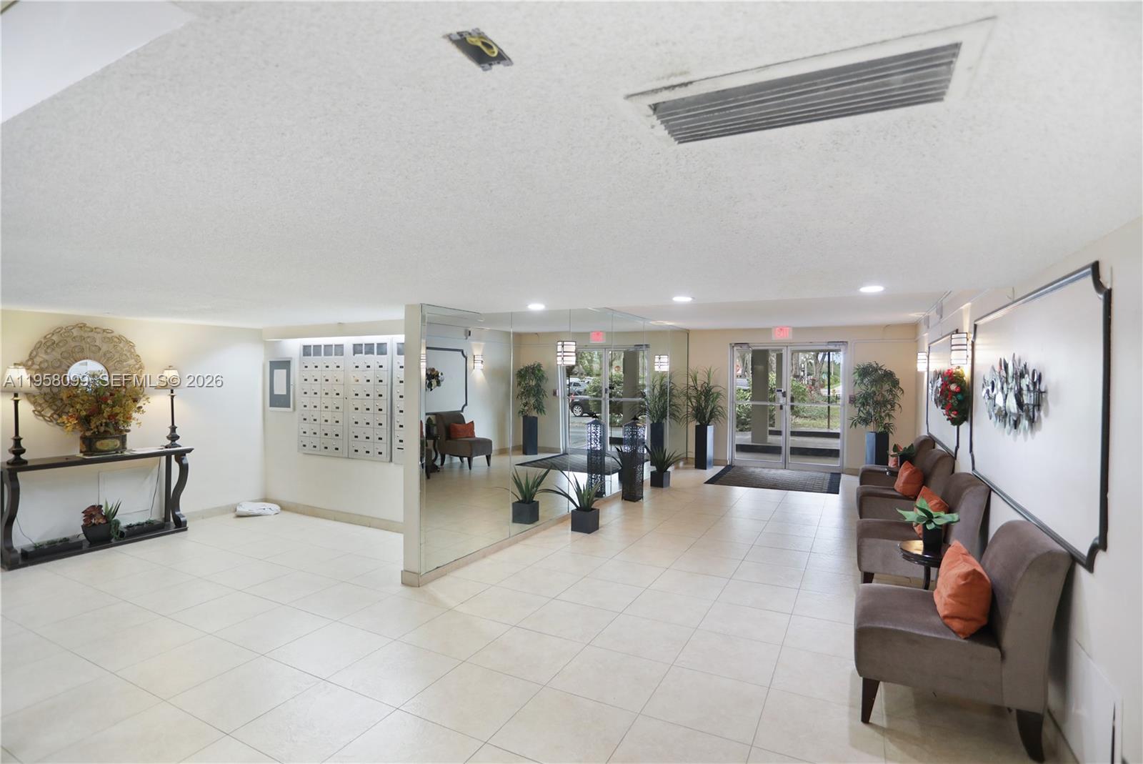 6600 Cypress Road, Unit 105 Plantation, FL 33317 - Photo 11 of 51 a view of a room with gym equipment and large mirror