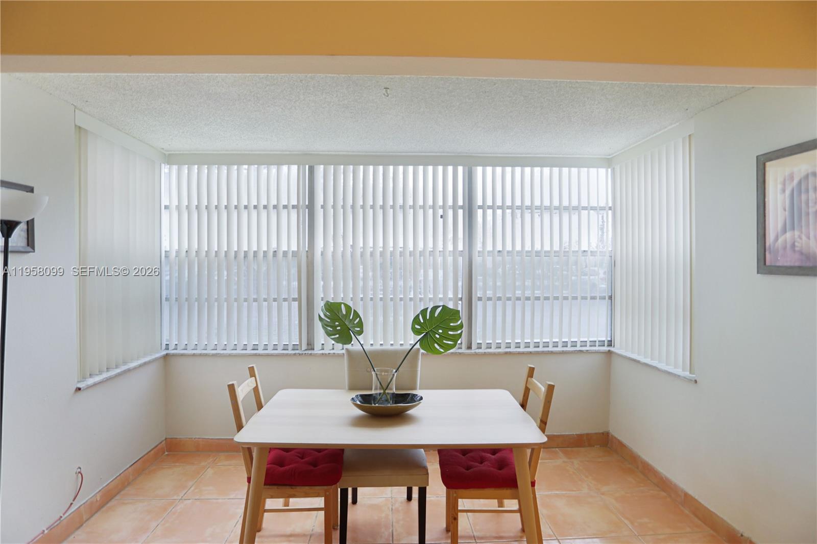 6600 Cypress Road, Unit 105 Plantation, FL 33317 - Photo 25 of 51 a view of a dining room with furniture and window