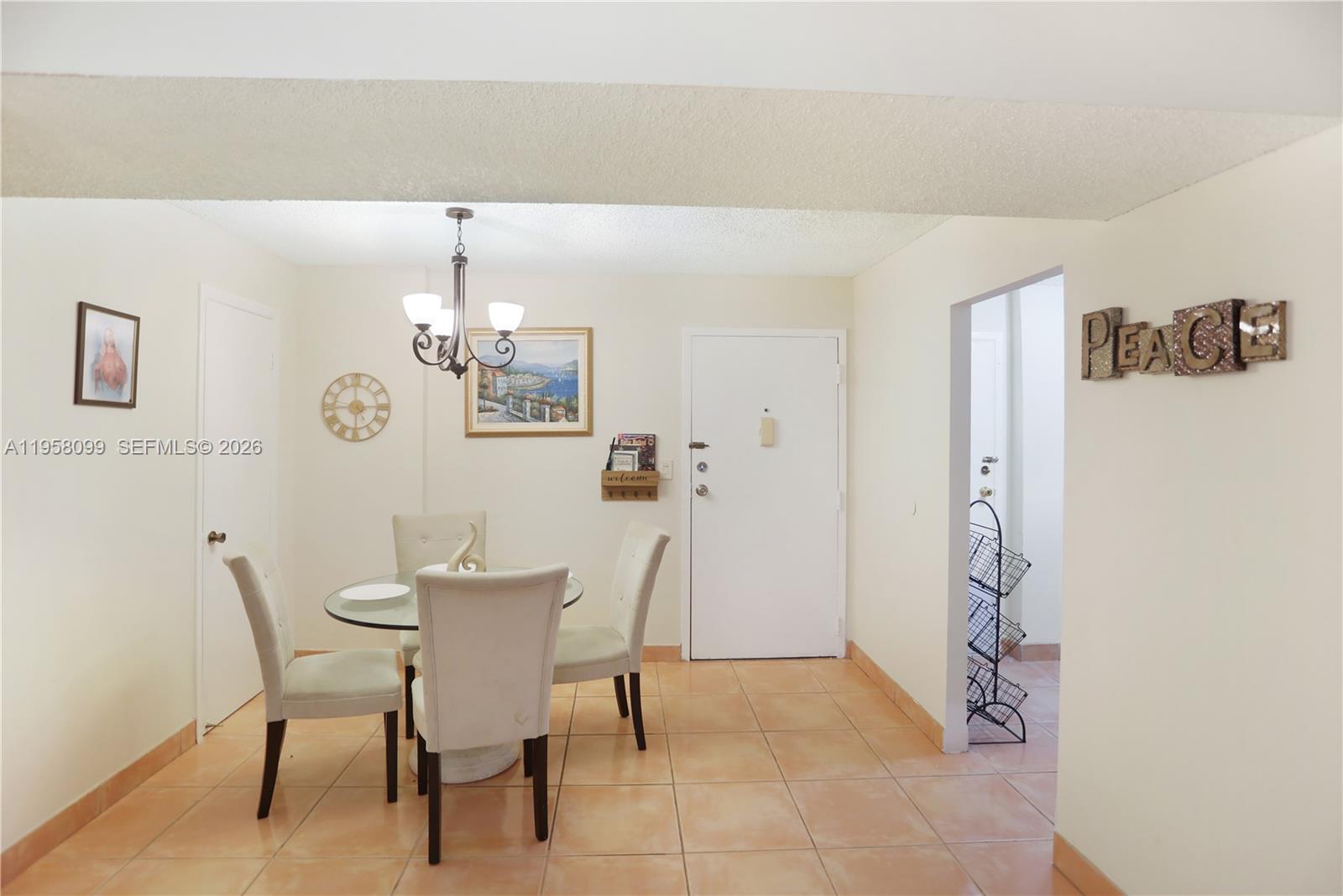 6600 Cypress Road, Unit 105 Plantation, FL 33317 - Photo 30 of 51 a dining room with furniture and chandelier