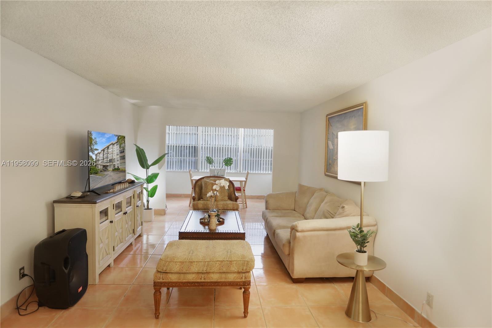 6600 Cypress Road, Unit 105 Plantation, FL 33317 - Photo 41 of 51 a bedroom with furniture and a wooden floor