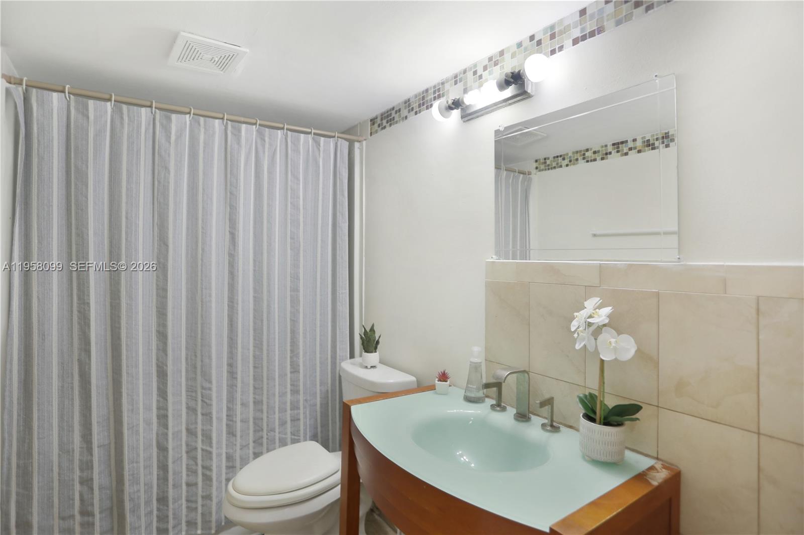 6600 Cypress Road, Unit 105 Plantation, FL 33317 - Photo 43 of 51 a bathroom with a sink toilet and shower