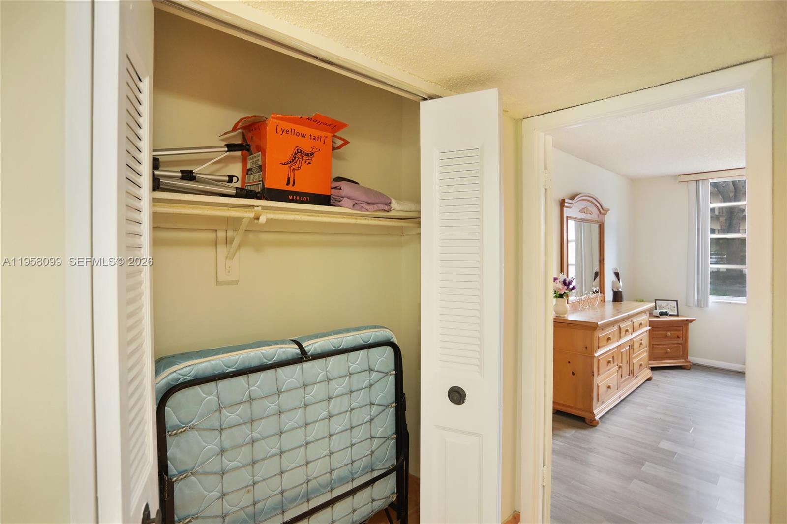 6600 Cypress Road, Unit 105 Plantation, FL 33317 - Photo 45 of 51 a living room with furniture and a wooden floor