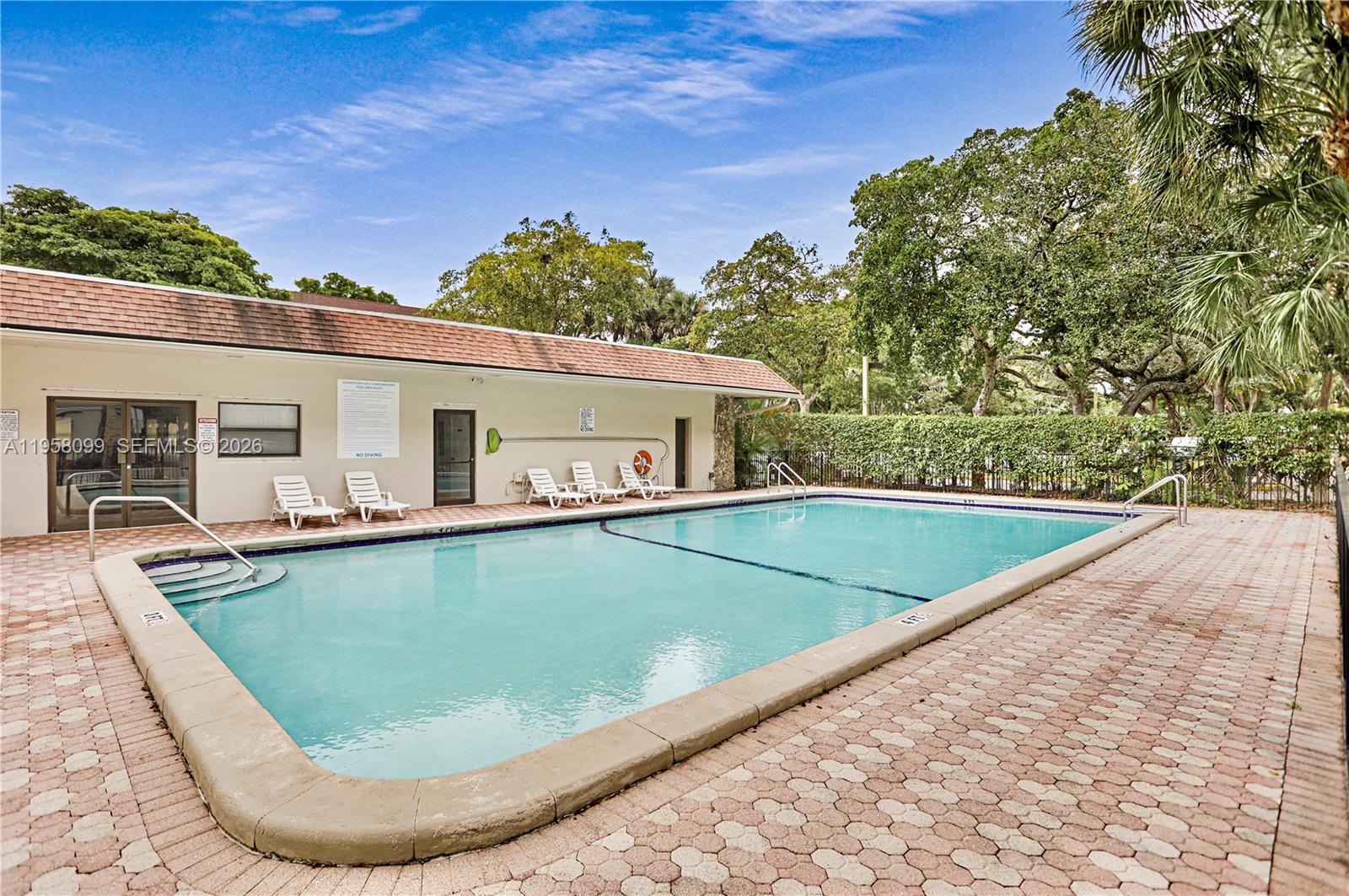 6600 Cypress Road, Unit 105 Plantation, FL 33317 - Photo 47 of 51 swimming pool with outdoor seating