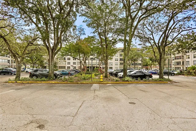 a view of a street with houses on both side