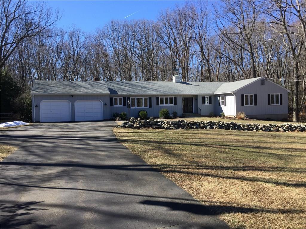 38 Hickory Road Woodbridge, CT 06525 - Photo 1 of 1 a front view of a house with a yard