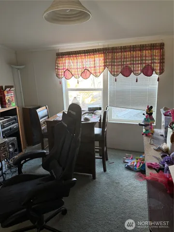 a bathroom with a tub a sink and a window