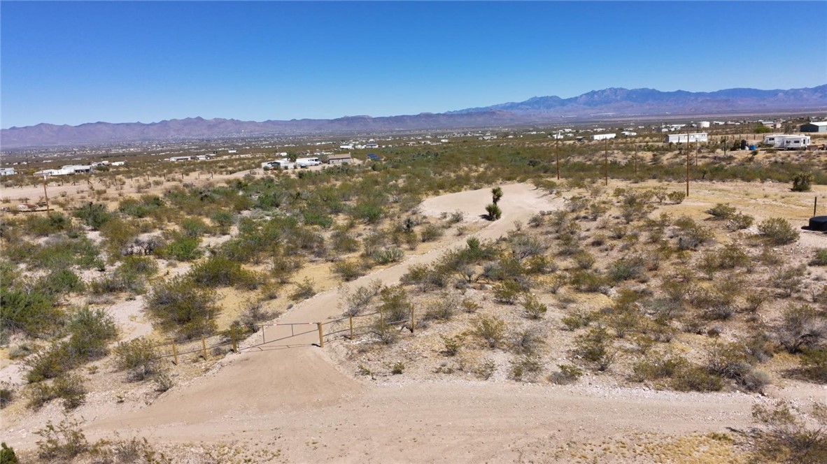 1386 Don Luis Road Golden Valley, AZ 86413 - Photo 28 of 47 Expansive property featuring desert vegetation, a clear sky, and distant mountains