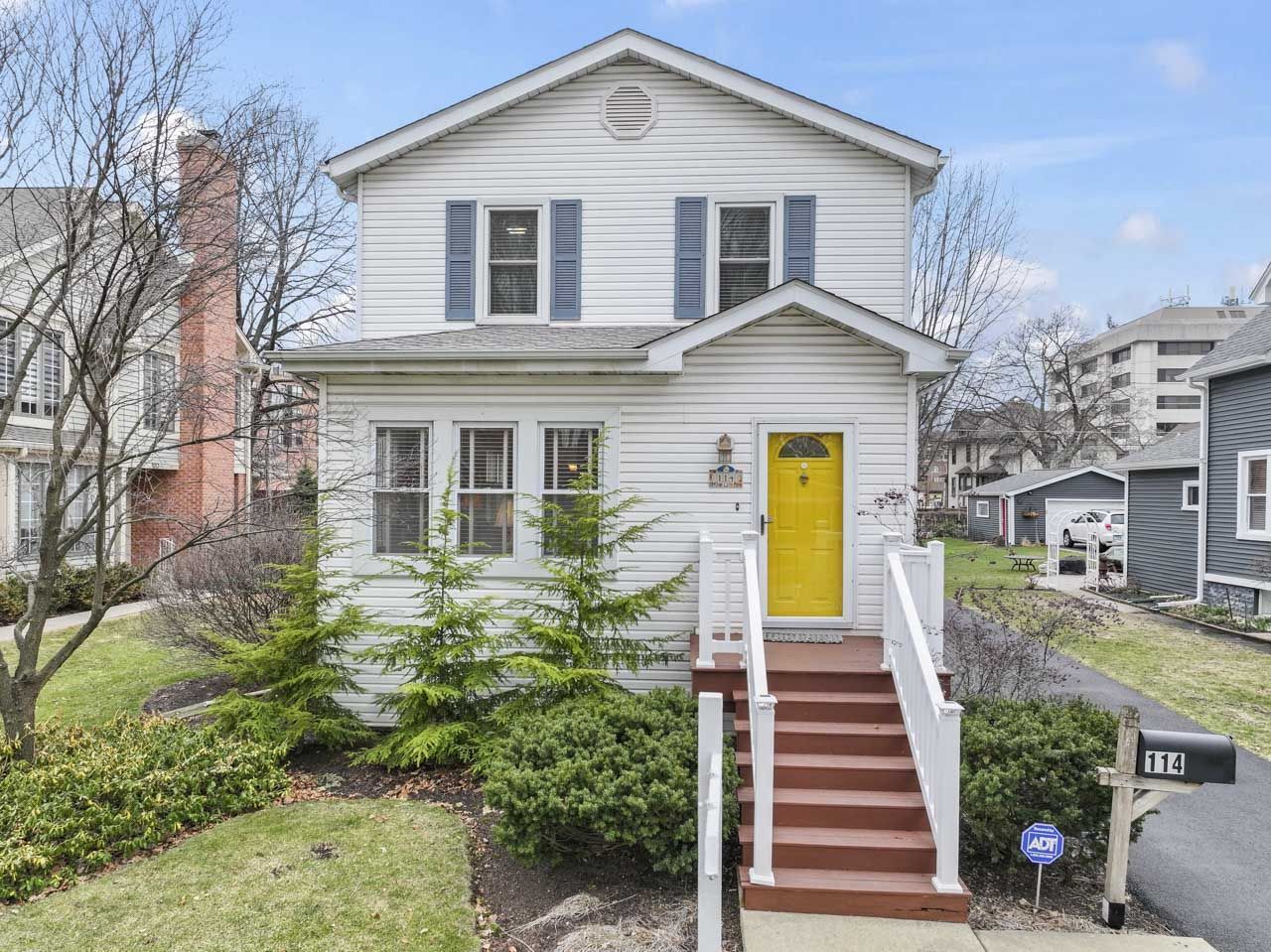 a front view of a house with a yard
