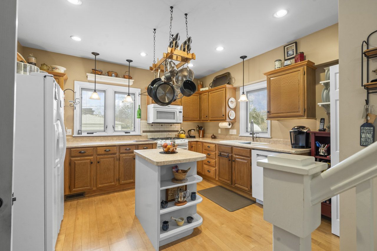 114 South Elm Street Mount Prospect, IL 60056 - Photo 14 of 44 a kitchen with a sink appliances cabinets and furniture