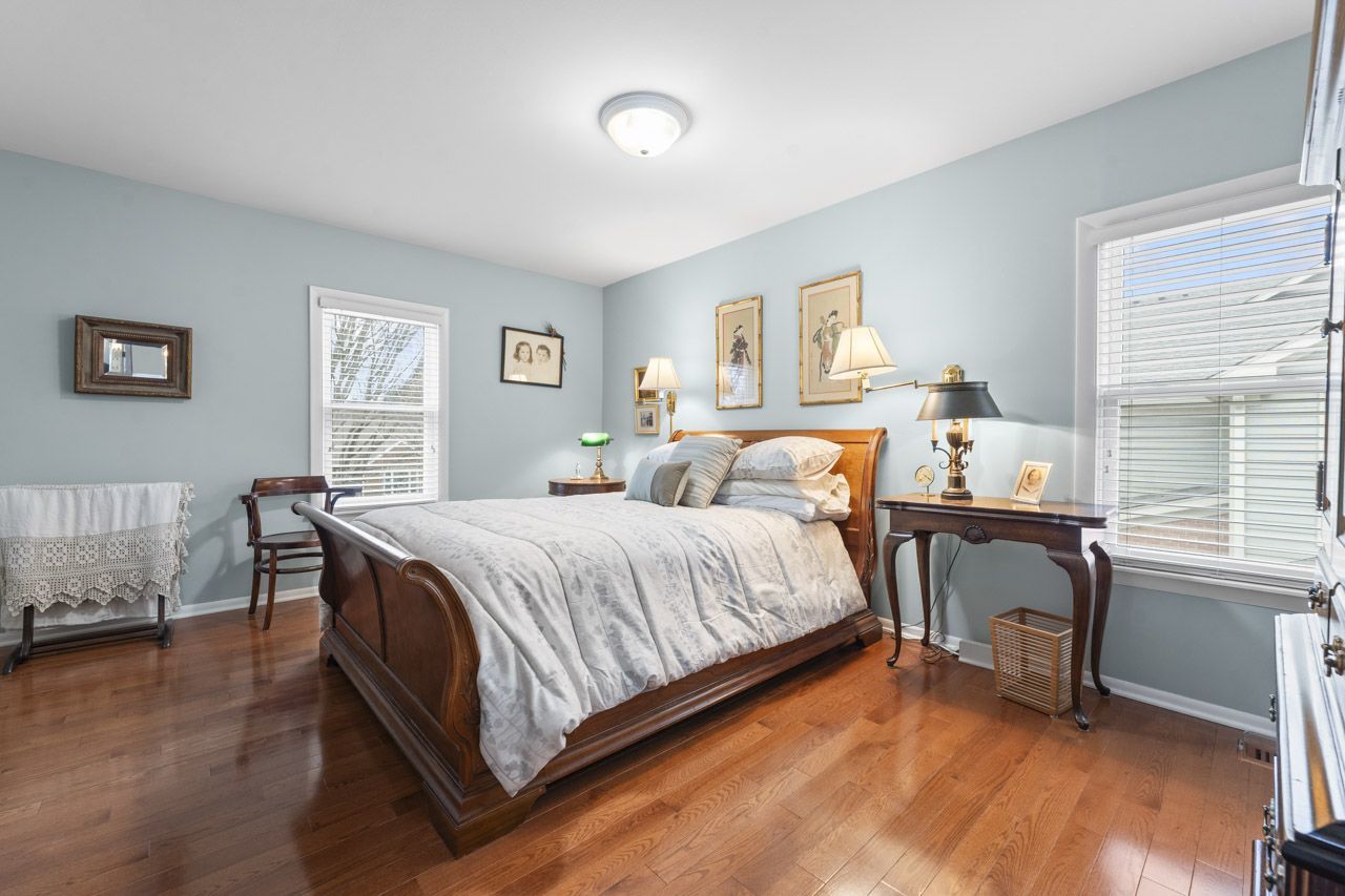 114 South Elm Street Mount Prospect, IL 60056 - Photo 21 of 44 a bedroom with a bed and a table in it
