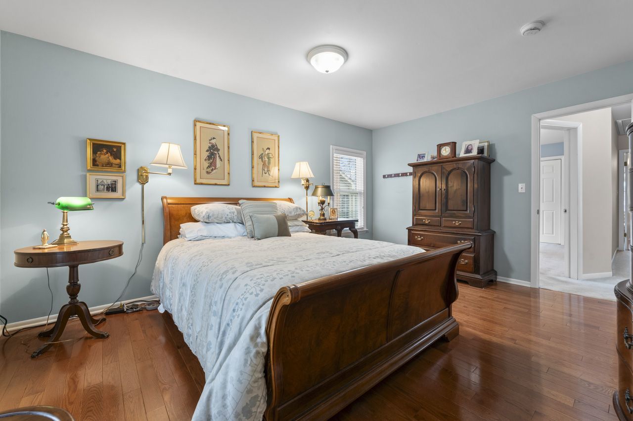 114 South Elm Street Mount Prospect, IL 60056 - Photo 22 of 44 a bedroom with a bed and wooden floor