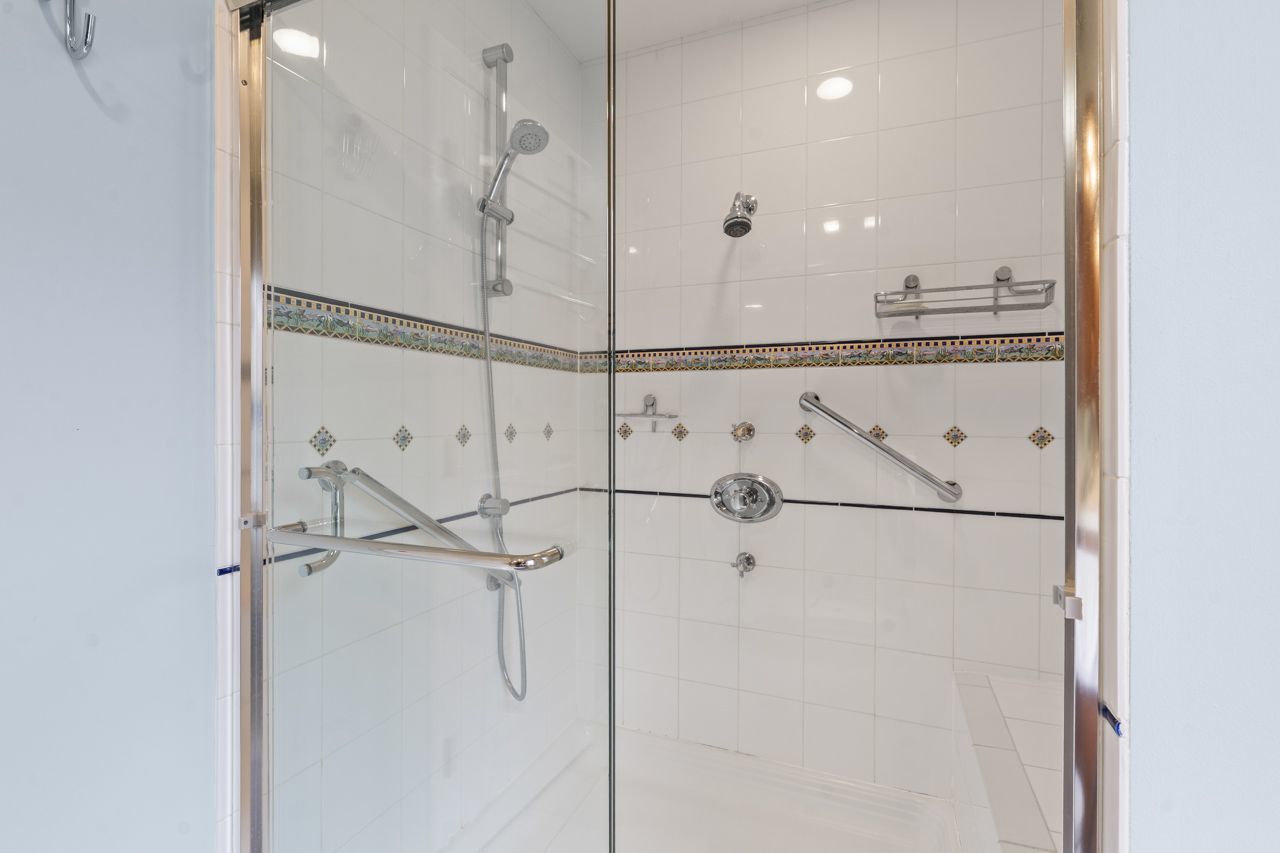 114 South Elm Street Mount Prospect, IL 60056 - Photo 30 of 44 a bathroom with a shower and a mirror