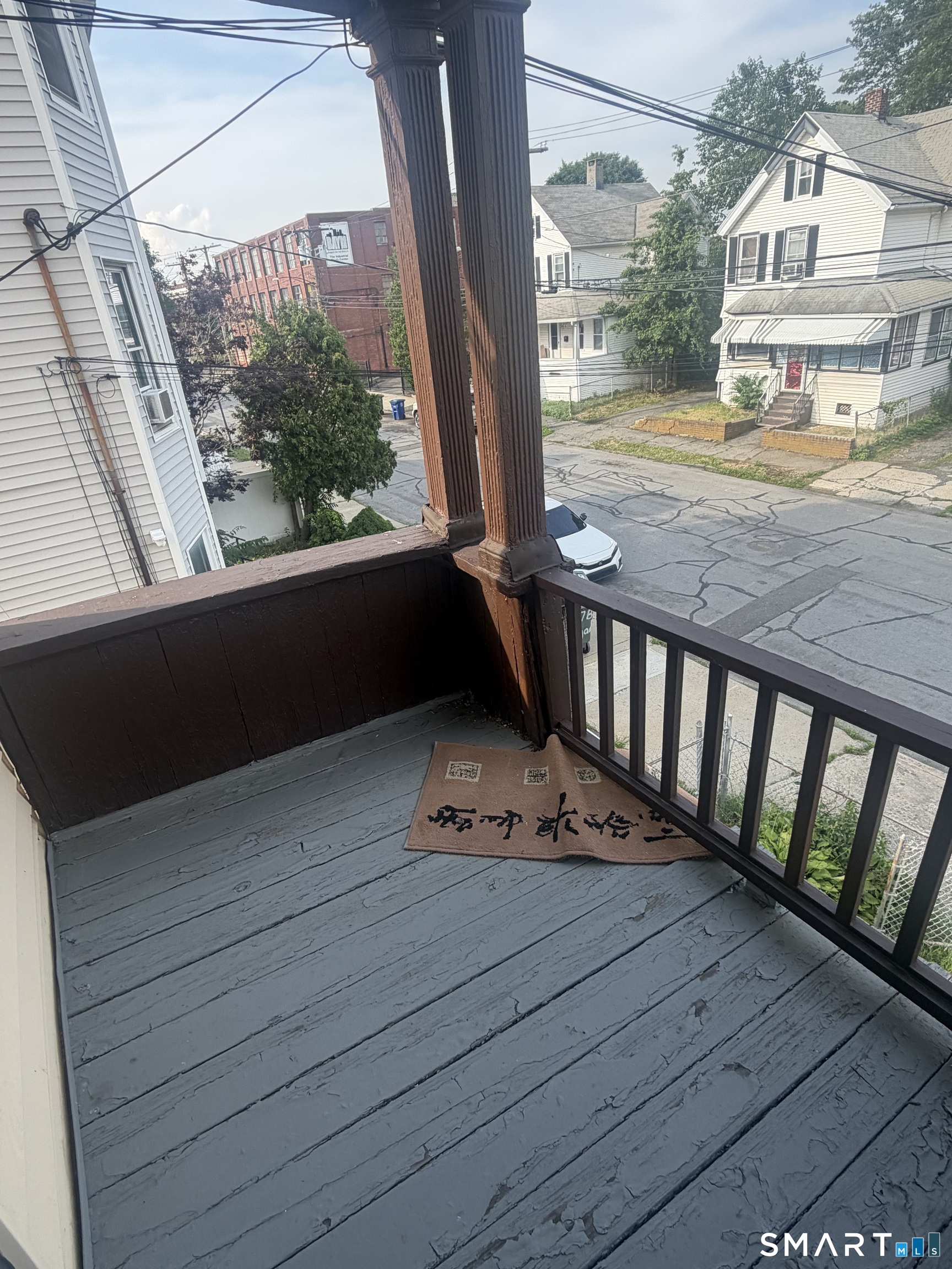 463 Logan Street, Unit 2 Bridgeport, CT 06607 - Photo 11 of 11 a view of a balcony with wooden floor