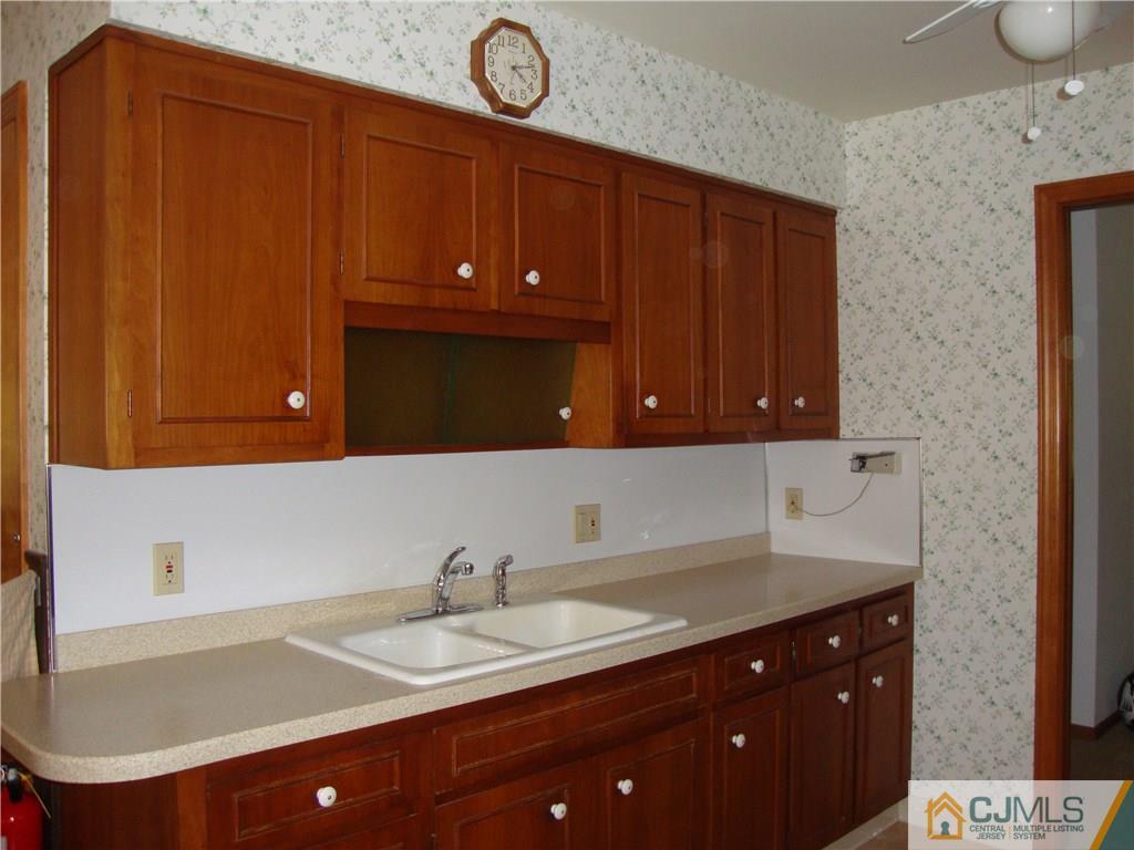 231 Davidson's Mill Road North Brunswick, NJ 08902 - Photo 2 of 17 a bathroom with a sink and a mirror