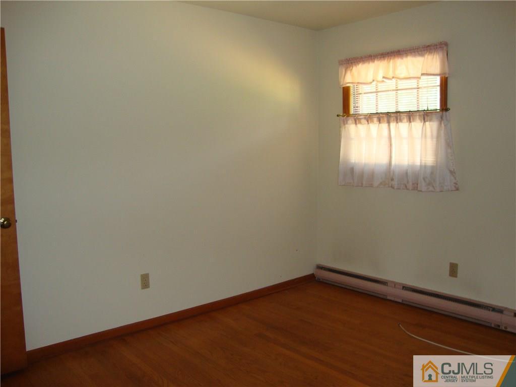 231 Davidson's Mill Road North Brunswick, NJ 08902 - Photo 11 of 17 an empty room with a window