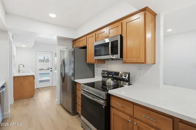 a view of a kitchen with a sink and a window