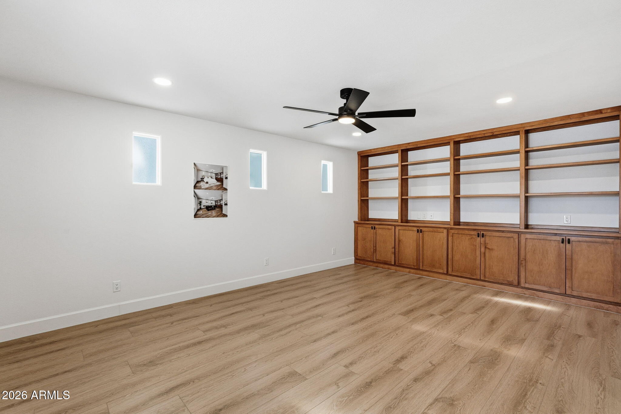 6615 East Phelps Road Scottsdale, AZ 85254 - Photo 20 of 53 a view of a big room with wooden floor and windows
