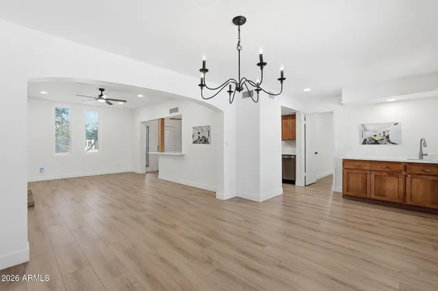 a spacious bathroom with a double vanity sink and a mirror