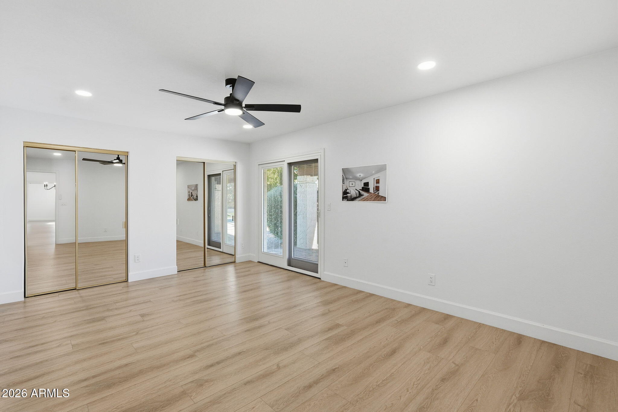 6615 East Phelps Road Scottsdale, AZ 85254 - Photo 23 of 53 wooden floor in an empty room with a window