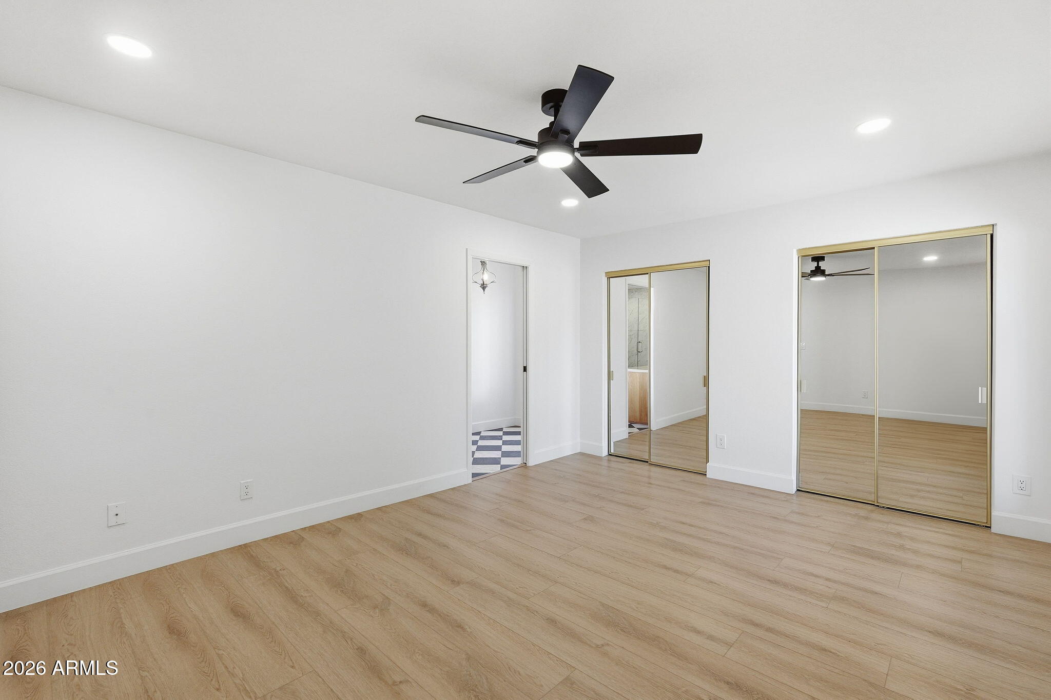 6615 East Phelps Road Scottsdale, AZ 85254 - Photo 25 of 53 a view of empty room with wooden floor and ceiling fan