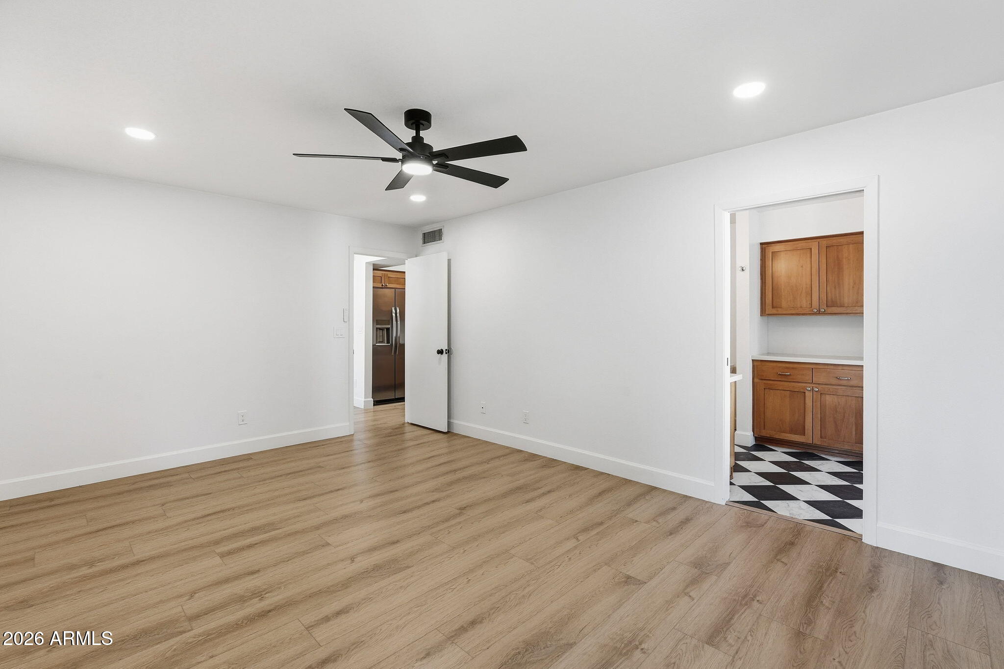 6615 East Phelps Road Scottsdale, AZ 85254 - Photo 26 of 53 a view of empty room with wooden floor