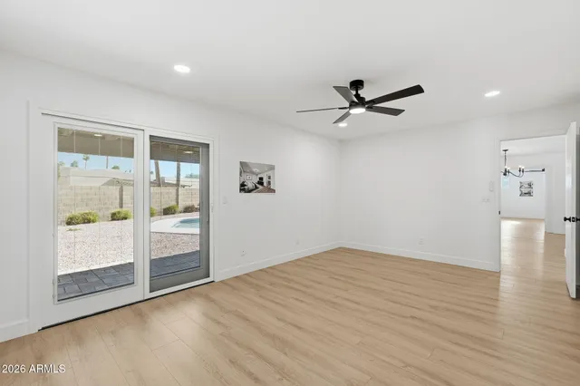 a spacious bathroom with a sink and a window