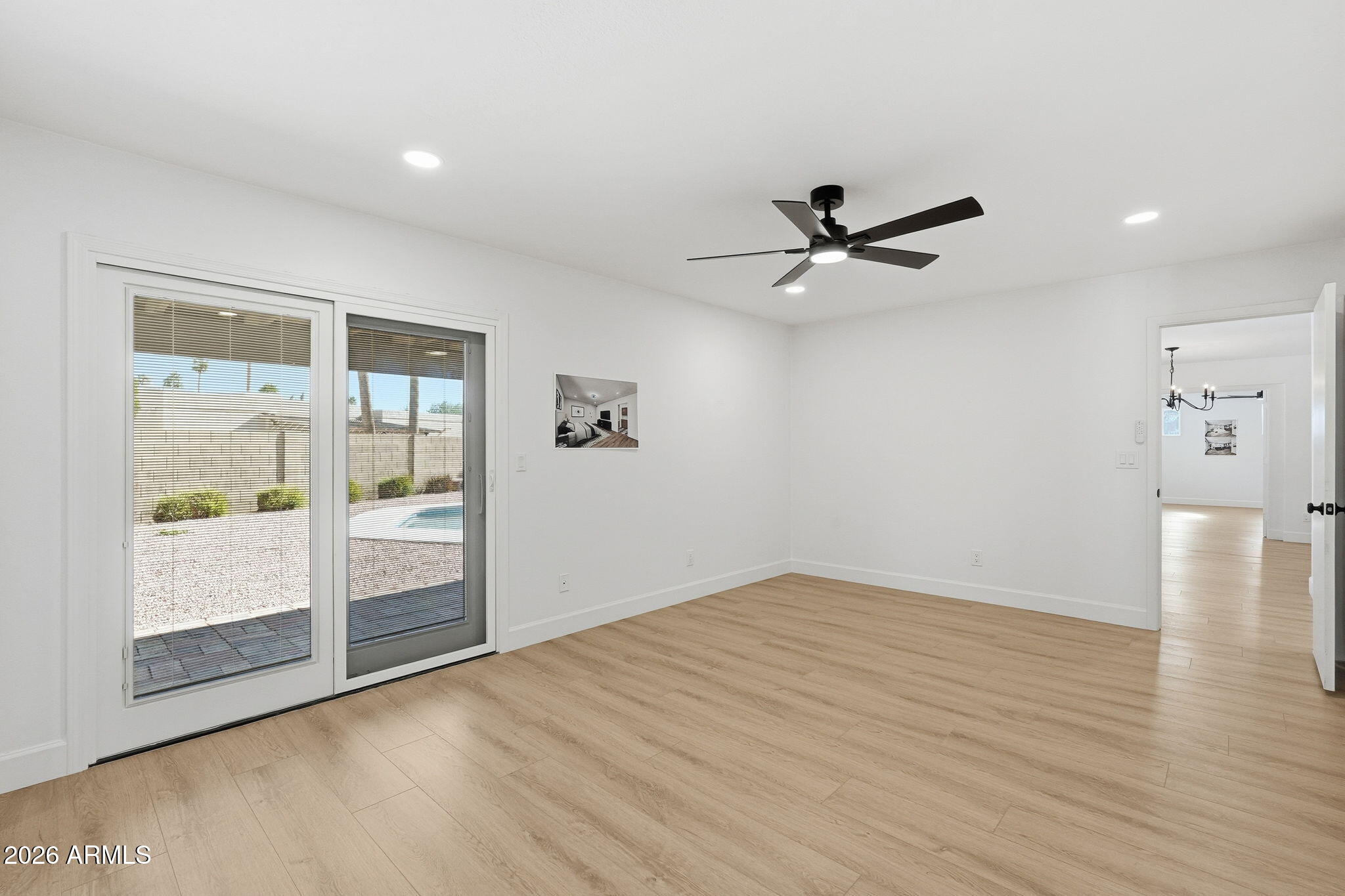 6615 East Phelps Road Scottsdale, AZ 85254 - Photo 29 of 53 wooden floor in an empty room with a window
