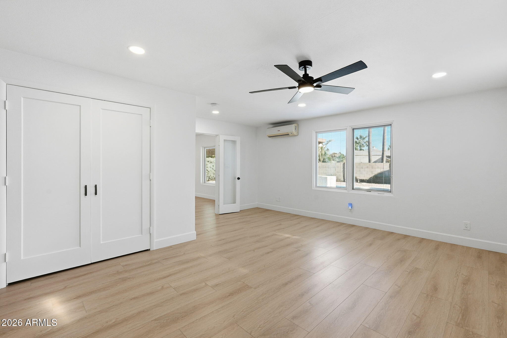 6615 East Phelps Road Scottsdale, AZ 85254 - Photo 31 of 53 wooden floor in an empty room with a window