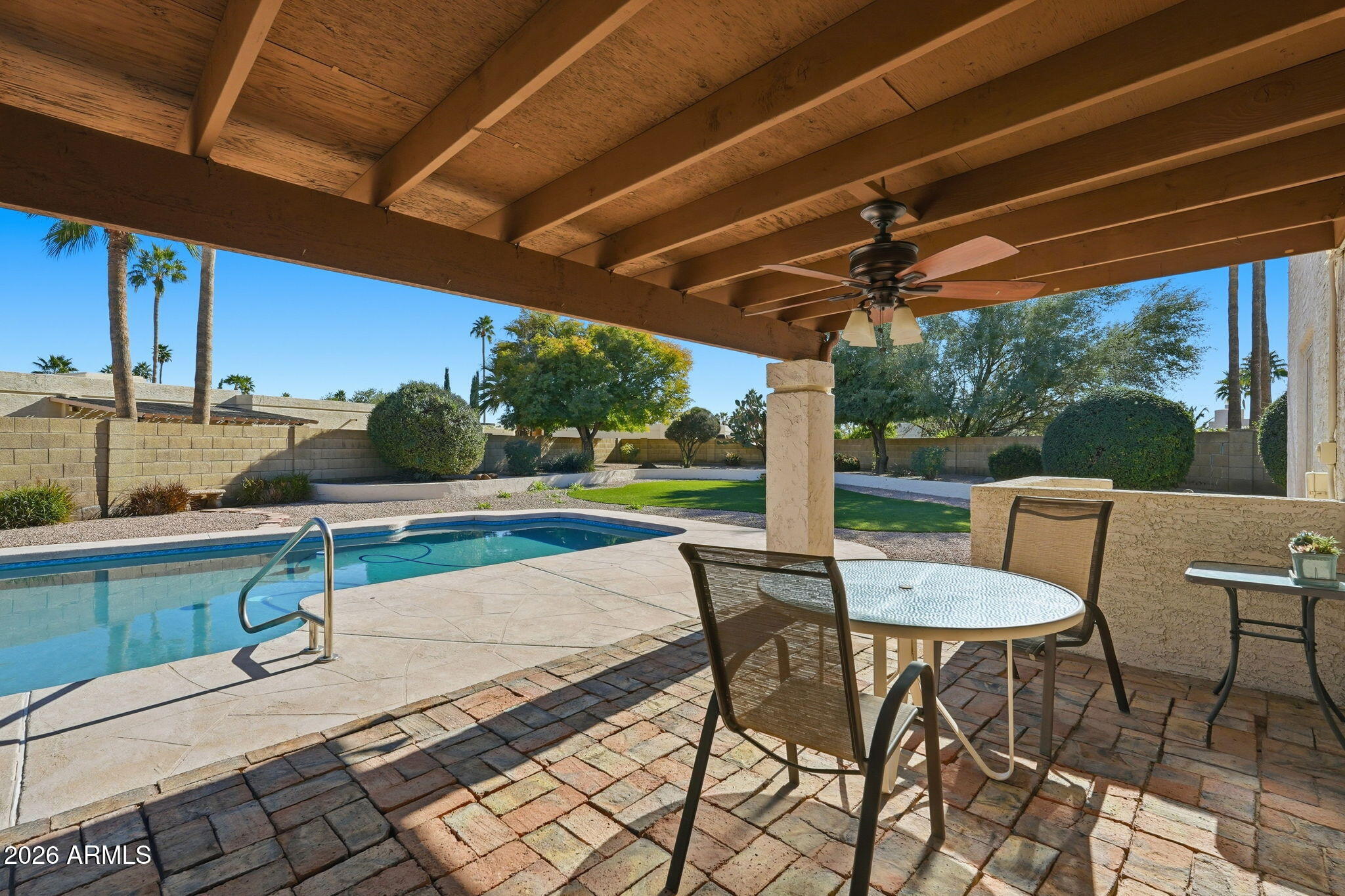 6615 East Phelps Road Scottsdale, AZ 85254 - Photo 39 of 53 a view of a patio with a table chairs and a patio